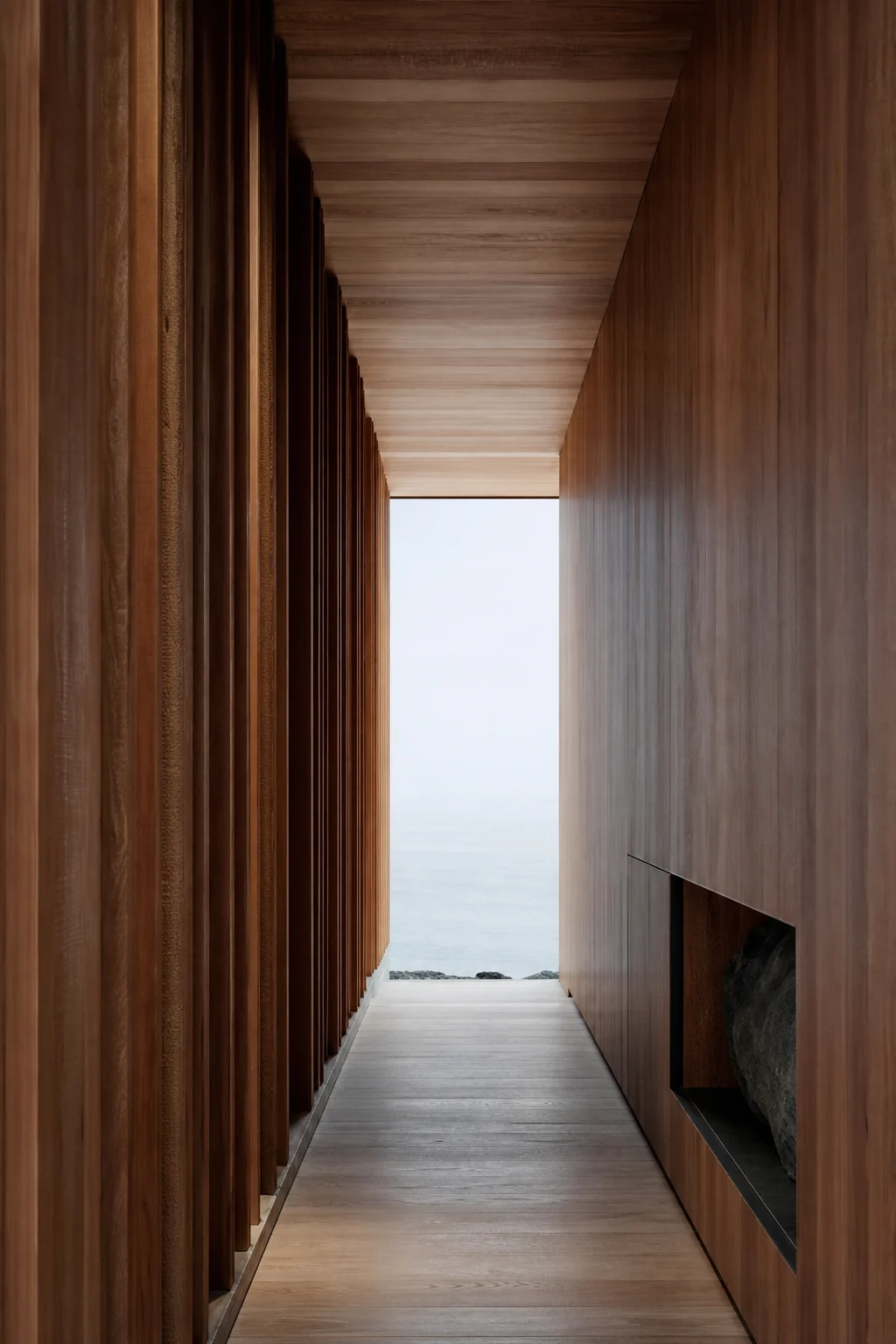 A quiet timber passage opening toward the water